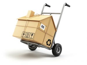 Hand truck with cardboard box as home isolated on white. Delivery or moving house concept. 3d